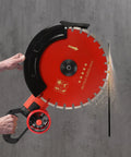 Heavy Duty Electric Concrete Saw With Four Thousand Watt Motor And Industrial Diamond Blade For Cutting Granite Porcelain Wood And Masonry job site ready, held in hand with water cooling feature.