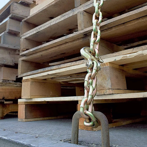 Rock Solid Grade 70 Chain Hook Half Inch Clevis Grab Hook 12000 Lbs Working Load Limit 2 Pack secured to pallets for hauling heavy equipment.