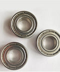 Professional Grade Solid Performer 440 Stainless Steel Deep Groove Ball Bearing S6015ZZ 75X115X20MM triple view on white background