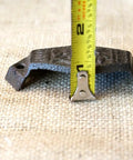 Top Notch Vintage Cast Iron Cup Pulls for Dresser Cabinet Bin Hardware measuring 4 inches on burlap background.