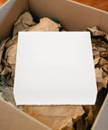 Top Shelf White Epe Foam Cushion Inserts 4 Pack Reusable Shipping Box Fillers Void Space Buffer Pads on top of packing material.