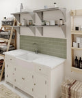 Stainless Steel Wall Shelf 24 Inch Long 12 Inch Deep With Bullnose Edge And 1 Inch Backsplash shown above a kitchen sink