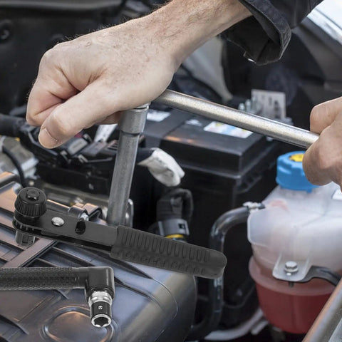 Compact Mini Ratcheting Wrench And Socket Tool Kit Tough As Nails Steel Spanners And Tight Squeeze Repairs For Automotive And Household Projects in use on an engine.