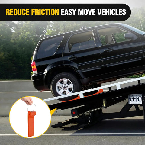 Black SUV being moved with Heavy Duty Wrecker Tire Skids 4 Pack Low Friction Rolling Mats For Flatbed Recovery Gear.