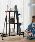 Floor Standing Ski And Snowboard Rack With 3 Tier Shelf Holds Boots Helmets And Packs Drill Free Mount No Sweat Setup in home setting.
