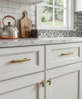 25 Pack Antique Brass Cabinet Pulls Made From Rock Solid Zinc Alloy Feature Ridiculously Smooth Gliding And Old School Swag For Kitchen Cupboards Laundry Rooms Home Office Drawers At Three Inch Center Spacing shown on white kitchen cabinetry.
