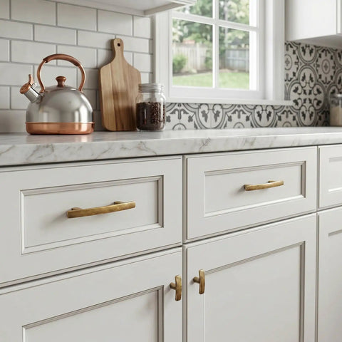 25 Pack Antique Brass Cabinet Pulls Made From Rock Solid Zinc Alloy Feature Ridiculously Smooth Gliding And Old School Swag For Kitchen Cupboards Laundry Rooms Home Office Drawers At Three Inch Center Spacing shown on white kitchen cabinetry.