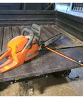 Heavy Duty Telescopic Firewood Measuring Stick With Super Strong Magnets For Fast Wood Cutting And Dang Easy Log Marking Yard Tool For Outdoor Campfire Prep And Homestead Wood Piles attached to a chainsaw in a truck bed.