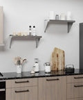Stainless Steel Wall Shelf 24 Inch Long 12 Inch Deep With Bullnose Edge And 1 Inch Backsplash in modern kitchen setting