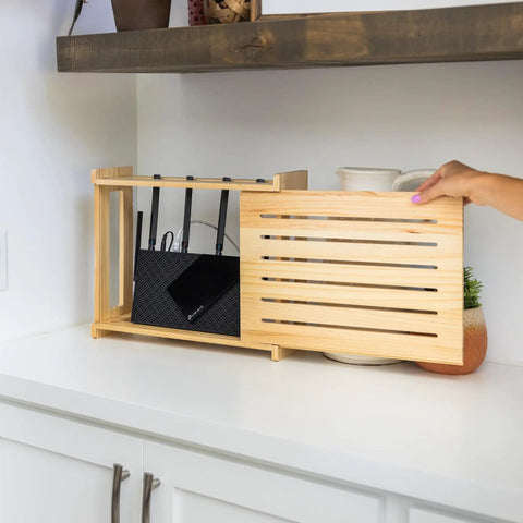Rustic Pine WiFi Router Storage Box With Wall Mount Decorative Modem Shelf Hider And Cable Management System Keeps Your Router Looking Slick Up To 11 Inches Tall Easy Home Organization For Modern Living on a kitchen counter.