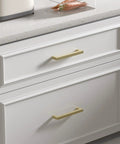 Snag These Top Notch Gold Cabinet Handles 30 Pack Featuring 3 Inch Hole Center Spacing Heavy Duty Solid Metal Construction And Slick Square Bar Pulls For Your Kitchen Remodel on white drawers.