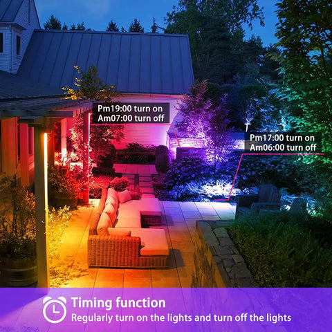 50W Outdoor RGB LED Flood Light With Remote And Built In Timer illuminating garden furniture and pathways in vibrant colors.