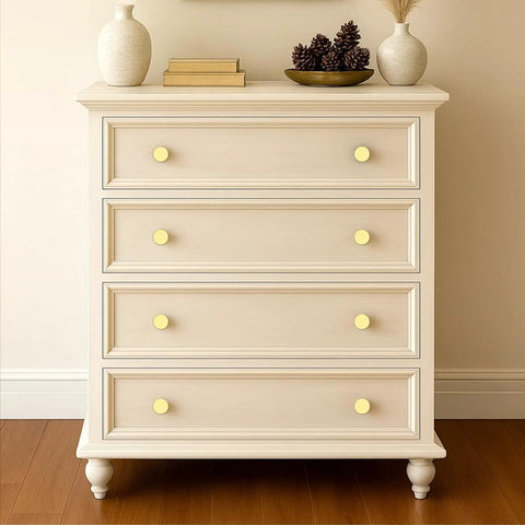 Thirty Piece Set of Slick Brushed Gold Cabinet Knobs With Knurled Textured Grip Heavy Duty Kitchen and Cabinet Hardware Perfect For Drawers and Cupboards Boasting No Sweat Installation and a Durable Corrosion Resistant Finish Looking Dang Good on a cream colored dresser.
