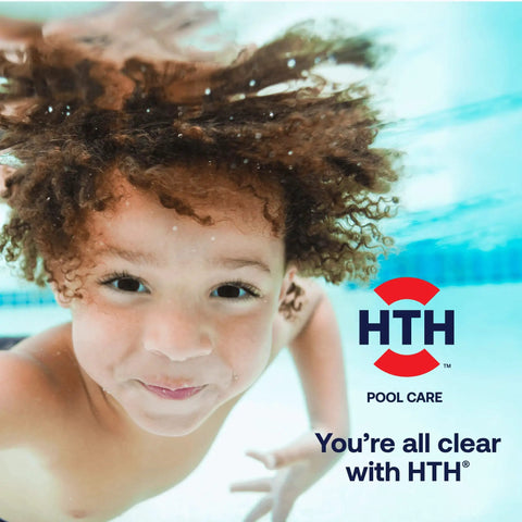 Child swimming underwater with clear water background, promoting Fast Dissolving Four In One Pool Shock Treatment.