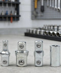 Four Piece Ratchet Wrench Socket Adapter Set With Chrome Vanadium Steel Construction Drive Converters And Reducers displayed on workbench