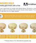Thirty Piece Set of Slick Brushed Gold Cabinet Knobs With Knurled Textured Grip Heavy Duty Kitchen and Cabinet Hardware under different light.