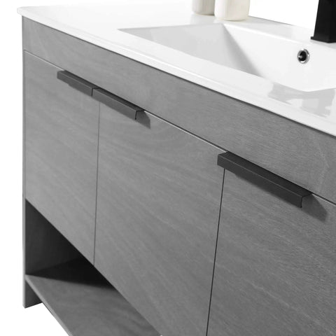 Slick 48 Inch Bathroom Vanity With Built In Sink And Modern Silhouettes Featuring Buttery Smooth Soft Close Doors Spacious Storage Drawers And A Rock Hard Finish Designed For Tiny Baths Requiring Full Assembly showing grey cabinet with sink and soft close doors.