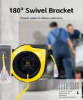 Heavy Duty Retractable Extension Cord Reel Rolls Up Crisp Saves Floor Space Delivers Serious Muscle For Garage Or Shop With 75 Foot 14 Gauge Cable Lighted Triple Outlets And 10 Amp Breaker showing 180° swivel bracket and yellow cord.