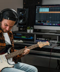 Musician using EVO 8 USB Audio Interface For Mac And Windows With 4 EVO Mic Pres JFET Instrument Input in home studio