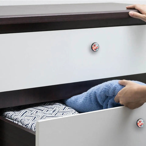 Person pulling a blue towel from a drawer featuring 4 Pack Crystal Glass Cabinet Knobs Featuring Slick Red Dragonfly Watercolor Art And Sturdy Black Base For Kitchen Drawers Real Pretty Dresser Pulls And Cupboard Handles Building A Top Shelf Home Vibe.