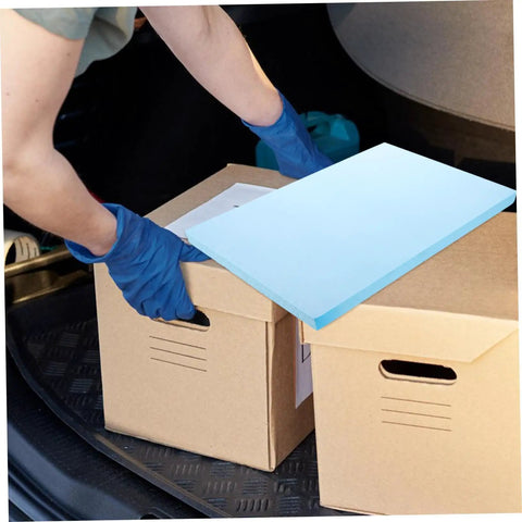 Person placing Premium Polyurethane Foam Sheet Cuts For Toolboxes And Cases Delivering Kick Ass Protection For Sensitive Gear During Road Trips And Moves With Heavy Duty Cushioning on cardboard boxes.