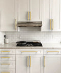 10 Pack Brushed Gold Knurled Cabinet Pulls 5 Inch 128mm Installed on White Kitchen Cabinets for a Sleek Finish