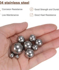 Hand holding assorted 304 stainless steel ball bearings in multiple sizes for the 24 Piece 304 Stainless Steel Ball Bearing Assortment Kit G200.