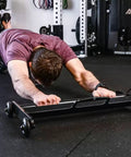 Premium Steel Frame Abdominal Wheel Core Roller With Straight Gliding Track for core workout on exercise mat.