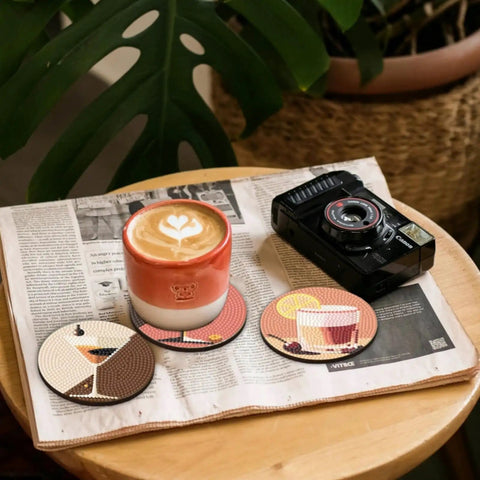8 Piece Dope Cocktail Diamond Painting Coaster Set With Holder For Drinks And Coffee Table displayed on magazine with coffee