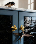 Blue cabinet with Solid Brass Gold Cabinet Knobs 4 Pack With Swallow Backplates, modern dresser handles, brushed brass finish.