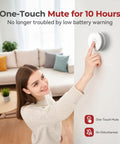 Woman using one-touch mute feature on heavy duty smoke detector with 9V replaceable battery for easy operation.
