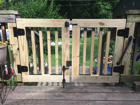 Wooden gate with Heavy Duty Black Gate Hinges 3.5 Inch With Screws Pack Of 6 for wood fences and barn doors outdoor setup.