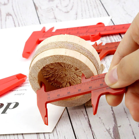 Depth Vernier Caliper Micrometer Gauge Measuring Tool measuring diameter of wooden piece, red plastic, user-friendly design.