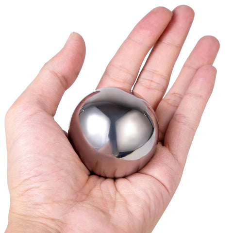 Rock Solid Two Piece AISI 52100 Chrome Steel Ball Bearings held in a hand, showcasing slick smooth finish for precision components.