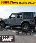 Heavy Duty Car Dolly Set Of Four Rock Solid 6000 Lbs Wheel Dollies With Parallel Tube Grip under a vehicle on pavement.