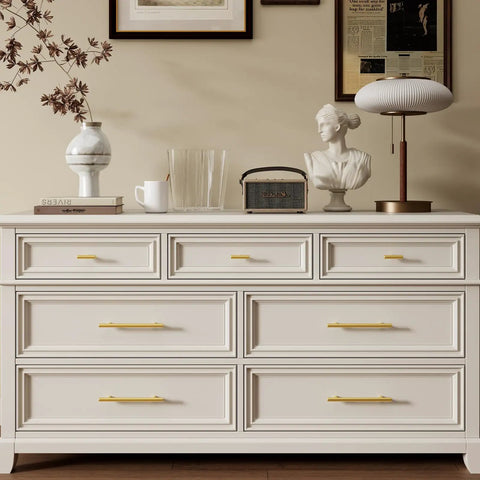 30 Pack Three Inch Hole Center Brushed Gold Stainless Steel Cabinet Handles on a stylish dresser in a modern living space.