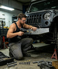 Pro Rivnut Plier Tool Kit For Quick Threaded Installation, Secure Metal Fabrication And Auto Repair With Precision Fit in use on a Jeep.