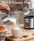Barista Quality Home Milk Frother And Warmer With Heating Function Four In One Hot And Cold Foam Maker 24 Oz Detachable Stainless Steel Jug pouring foam into cappuccino