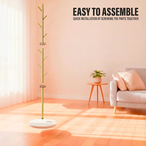 Freestanding Metal Coat Rack With 8 Hooks, Space Saving Hall Tree for Entryway in gold finish in a sunny living room.