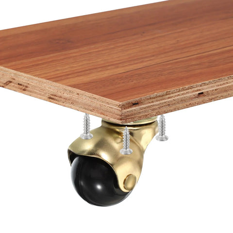 1.5 Inch Ball Caster Wheels Set Of 4 For Furniture, 360 Degree Swivel Top Plate Casters In Gold Finish installed on wooden surface