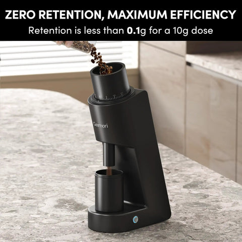 Heavy Duty Single Dose Coffee Grinder With Six Conical Burrs And Stepless Dial delivers fine ground beans for espresso, shown on marble countertop.