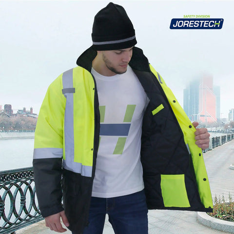 Man wearing Hi Vis Yellow Waterproof Safety Parka With Reflective Stripes, ANSI Class 3 Type R Insulated Work Jacket for roadwork.