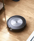 Robot vacuum on hardwood floor with Three Pack High Efficiency Replacement Filters For Roomba E I J Series And Roomba Combo I5 J5 Traps Ninety Nine Percent Pet Dander Allergens And Keeps Your Air Fresh