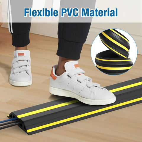 Person stepping on Heavy Duty PVC Cord Cover Protector 10 ft Floor Cable Duct That Unrolls Easily Prevents Trip Hazards.