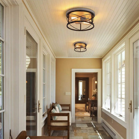 Two Light Rustic Oak White Flush Mount Ceiling Light With Black Open Cage illuminating a cozy farmhouse entryway