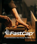 Person measuring wood with pencil, showcasing craftsmanship in a workshop for FastCap products.
