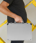 Person holding a Slick Aluminum Alloy Toolcase Featuring Custom Foam Padding, compact and lightweight design for tools.