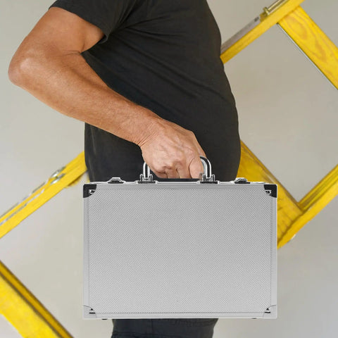 Person holding a Slick Aluminum Alloy Toolcase Featuring Custom Foam Padding, compact and lightweight design for tools.