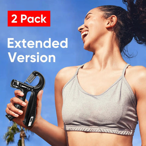 Grip Strength Trainer Set Two Pack With Adjustable Resistance 10 To 130 Lbs Hand Gripper in hand of woman exercising outside.