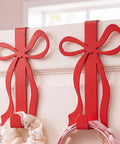 Heavy duty red bow over the door hooks for coats and towels, 18cm wide, ideal for organizing accessories.
